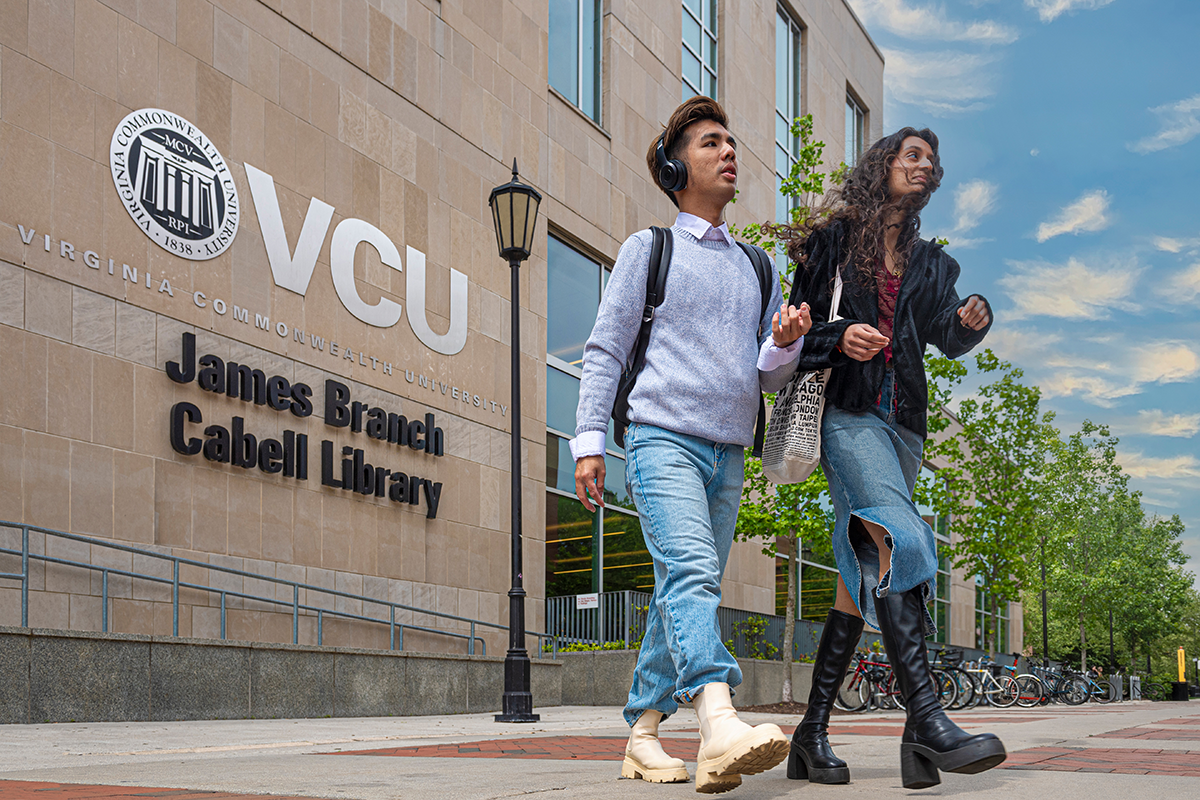 2 students walking in front of VCU Cabell Library