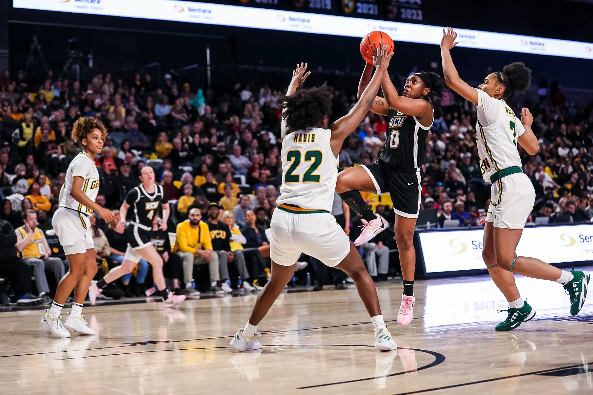 Women playing basketball