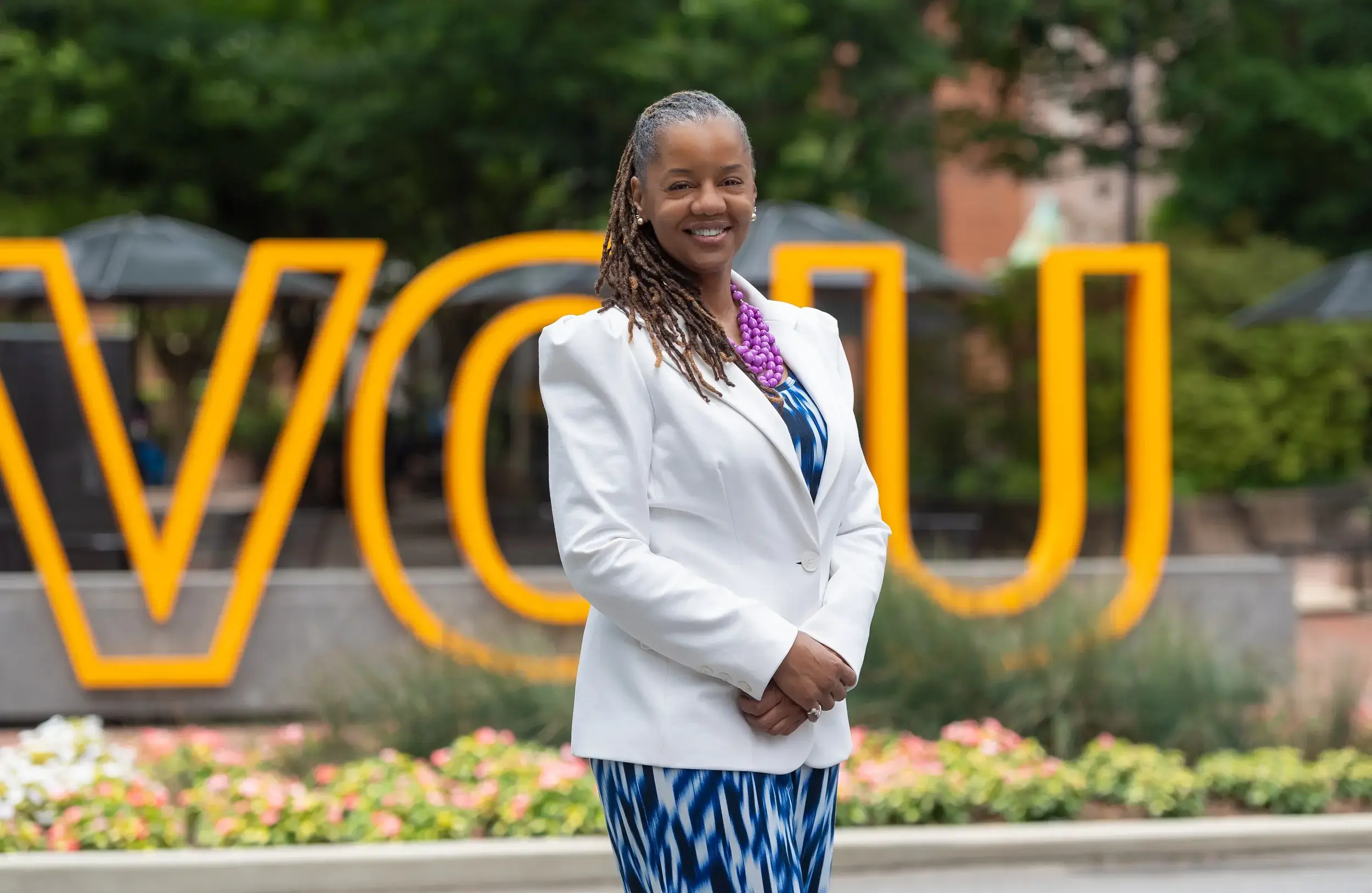 Melissa Tyler standing in front of VCU sign